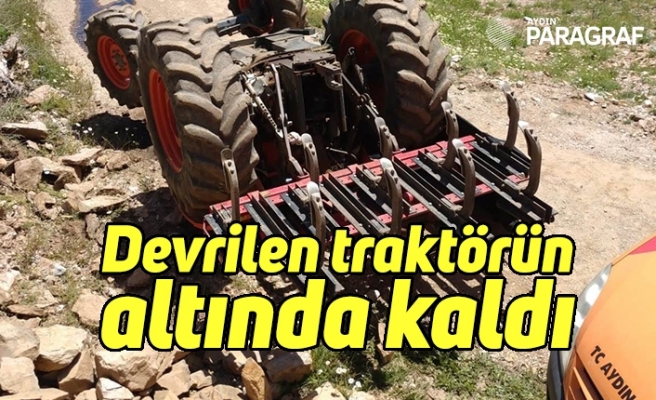 Devrilen traktörün altında kaldı