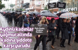 Aydınlı kadınlar yağmur altında kadına şiddete...